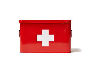 First aid kit in a red box with a white cross
