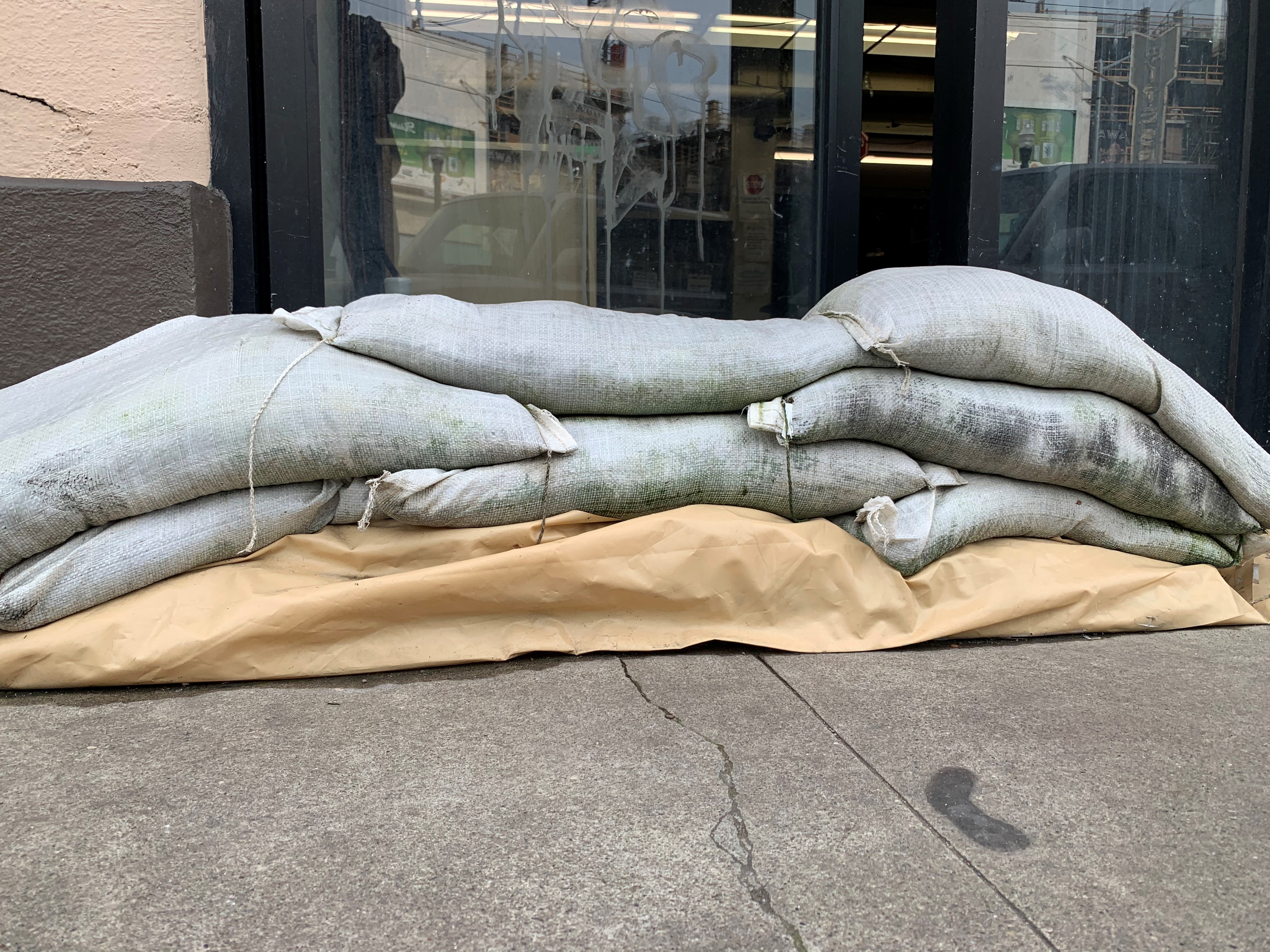sand bags laid is a brick formation to show how to correctly place them.